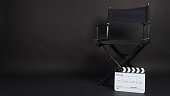 Black director chair and Clapperboard or movie slate use in video production ,film, cinema industry on black background.