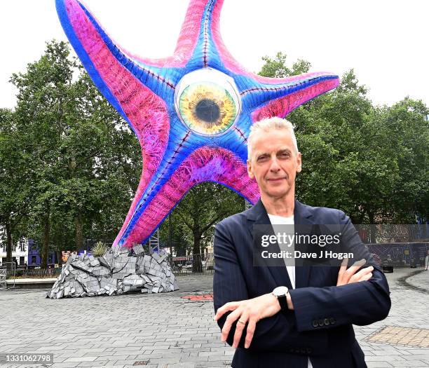 Peter Capaldi, who plays genius Scientist ‘Thinker’ in James Gunn’s The Suicide Squad, poses with ‘Starro’ the giant Starfish in London’s Leicester...