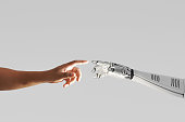 robot hand touching with human hand