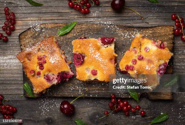 homemade fruit cake sweet pie with various berry fruits on a rustic table tabletop view - cherry pie stock pictures, royalty-free photos & images