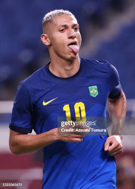 Richarlison of Team Brazil celebrates after scoring their side's third goal during the Men's First Round Group D match between Saudi Arabia and...