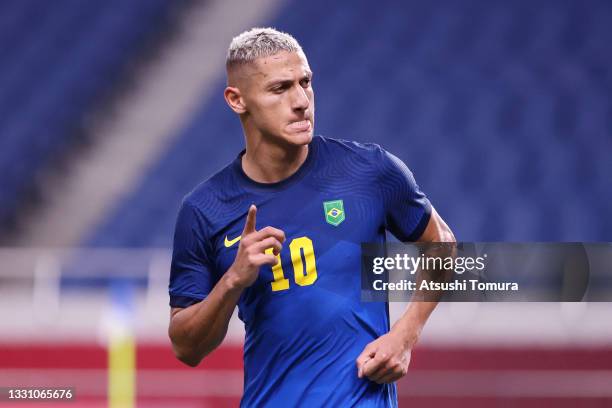 Richarlison of Team Brazil celebrates after scoring their side's third goal during the Men's First Round Group D match between Saudi Arabia and...