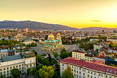 Beautiful drone shot of downtown district of Sofia, Bulgaria, St. Alexader Nevski Cathedral in the middle, gold colored domes. (Bulgarian: Красив кадър от дрон на централната част на София, България,  хра