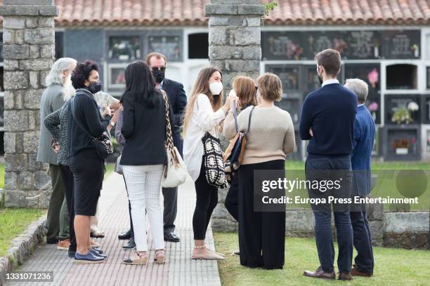 Relatives of Menchu Alvarez at the cemetery after bidding farewell to the journalist, on 28 July 2021, in Ribadadasella, Spain.