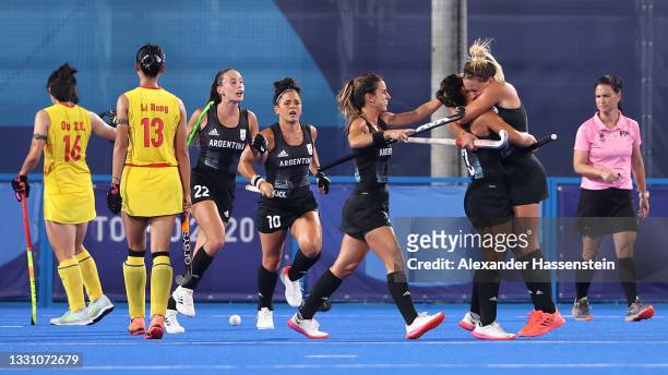 Agustina Gorzelany of Team Argentina celebrates, embracing teammate Maria Noel Barrionuevo after scoring their team's first goal during the Women's...