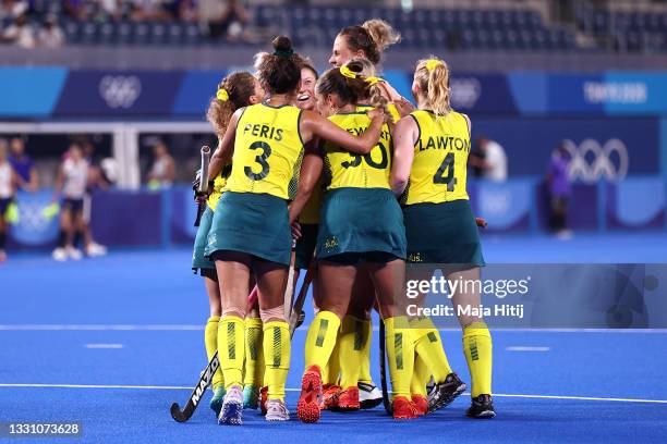 Madison Mae Fitzpatrick of Team Australia celebrates with teammates after scoring their team's first goal during the Women's Preliminary Pool B match...