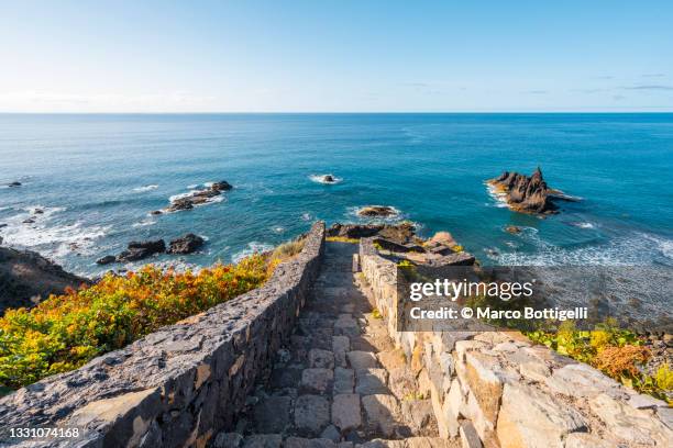 stone stairway leading to atlantic ocean, tenerife, spain - kanarische inseln stock-fotos und bilder