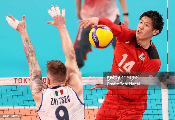 Yuki Ishikawa of Team Japan competes against Ivan Zaytsev of Team Italy during the Men's Preliminary Round - Pool A volleyball on day five of the...