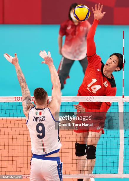 Yuki Ishikawa of Team Japan competes against Ivan Zaytsev of Team Italy during the Men's Preliminary Round - Pool A volleyball on day five of the...