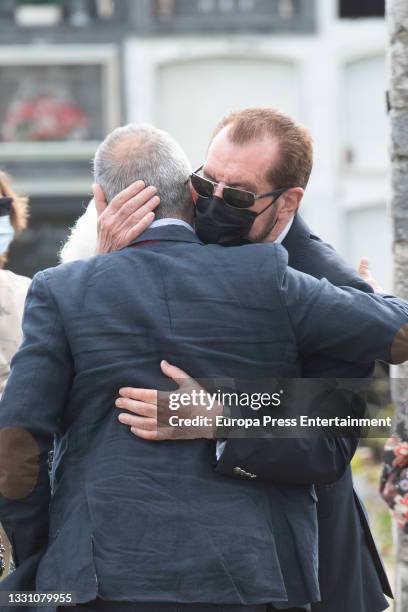 Jesus Ortiz with family members at the cemetery to say goodbye to the journalist, on 28 July 2021, in Ribadasella, Spain.