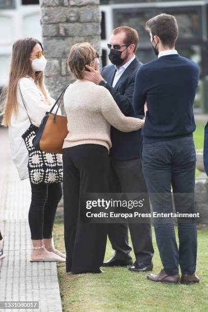 Jesus Ortiz with family members at the cemetery to say goodbye to the journalist, on 28 July 2021, in Ribadasella, Spain.