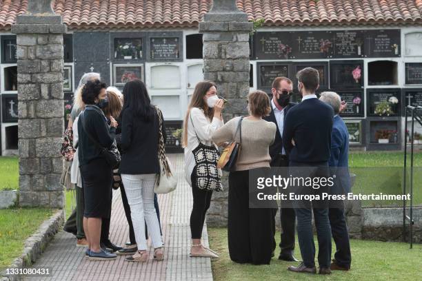Relatives of Menchu Alvarez at the cemetery bid farewell to the journalist, 28 July 2021, in Ribadadasella, Spain.