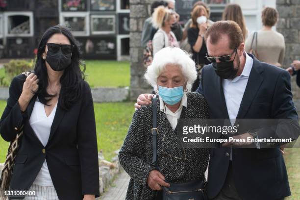 Ana Togores, Marisol Alvarez and Jesus Ortiz leave the cemetery after bidding farewell to the journalist, Menchu Alvarez on 28 July 2021, in...