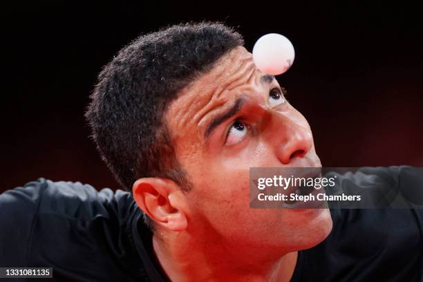 Omar Assar of Team Egypt serves the ball during his Men's Singles Quarterfinals table tennis match on day five of the Tokyo 2020 Olympic Games at...