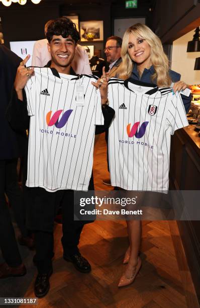 Karim Zeroual and Ashley Roberts attend a brunch to celebrate the partnership between World Mobile and Fulham FC at Craven Cottage on July 28, 2021...