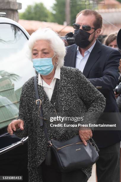 Marisol Alvarez and Jesus Ortiz leave the cemetery after saying goodbye to the journalist, Menchu Alvarez on 28 July 2021, in Ribadadasella, Spain.