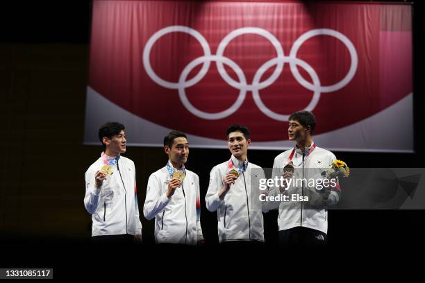 Gold medalists Sanguk Oh, Junho Kim, Bongil Gu and Junghwan Kim of Team South Korea pose with their gold medals during the Men's Sabre Team Victory...