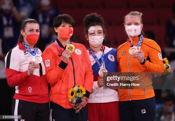 Silver medalist Michaela Polleres of Team Austria, gold medalist Chizuru Arai of Team Japan, Madina Taimazova of Russian Olympic Committee and bronze...