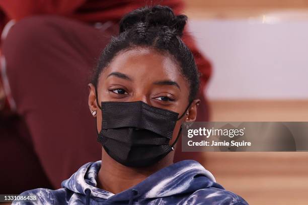 Simone Biles of Team United States watches the Men's All-Around Final on day five of the Tokyo 2020 Olympic Games at Ariake Gymnastics Centre on July...