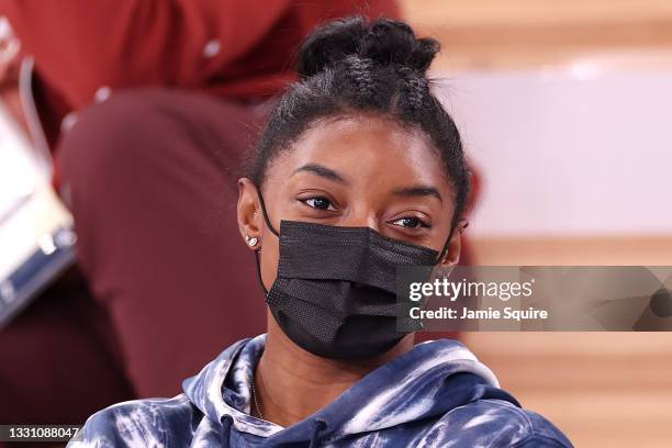 Simone Biles of Team United States watches the Men's All-Around Final on day five of the Tokyo 2020 Olympic Games at Ariake Gymnastics Centre on July...