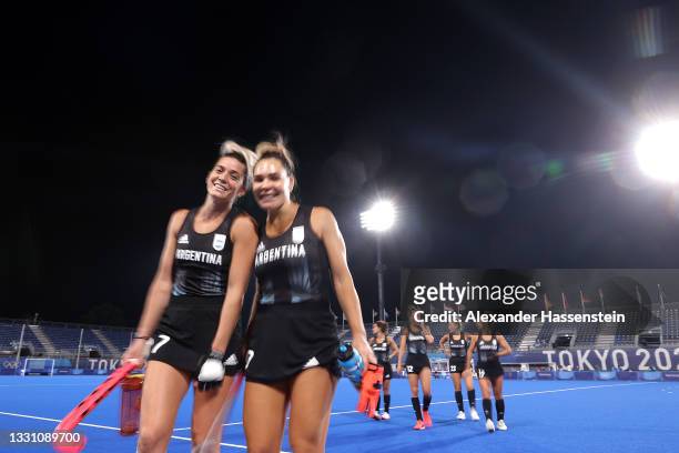 Agustina Albertarrio and Maria Noel Barrionuevo of Team Argentina leave the pitch following the Women's Preliminary Pool B match between Argentina...
