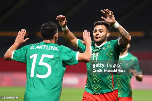 Alexis Vega of Team Mexico celebrates with Uriel Antuna after scoring their side's first goal during the Men's First Round Group A match between...