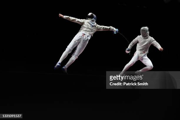 Enrico Berre' of Team Italy competes against Junho Kim of Team South Korea during the Men's Sabre Team Gold Medal Match on day five of the Tokyo 2020...