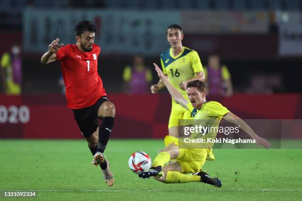 Salah Mohsen of Team Egypt is challenged by Kye Rowles of Team Australia during the Men's Group C match between Australia and Egypt on day five of...