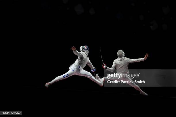 Luca Curatoli of Team Italy competes against Sanguk Oh of Team South Korea during the Men's Sabre Team Gold Medal Match on day five of the Tokyo 2020...