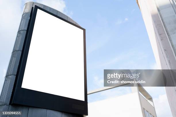 blank advertising screen against sky - european outdoor urban walls stockfoto's en -beelden