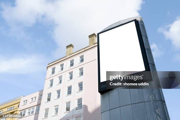 blank advertising screen against sky - building billboard stock pictures, royalty-free photos & images