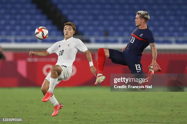 Ritsu Doan of Team Japan is challenged by Clement Michelin of Team France during the Men's Group A match between France and Japan on day five of the...