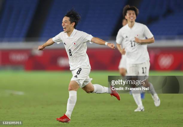 Koji Miyoshi of Team Japan celebrates after scoring their side's third goal during the Men's Group A match between France and Japan on day five of...