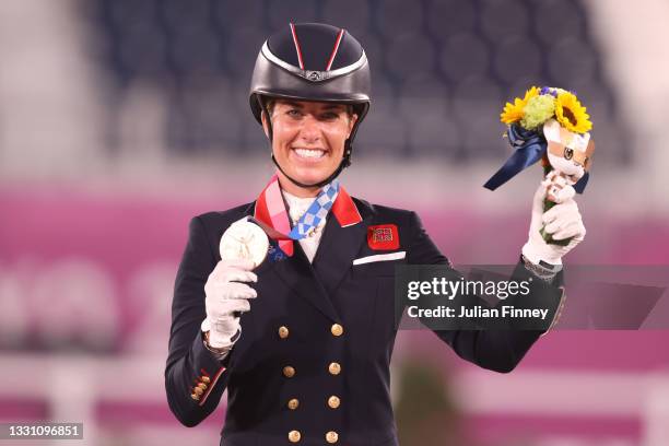 Bronze medalist Charlotte Dujardin of Team Great Britain poses on the podium during the medal ceremony for the Dressage Individual Grand Prix...