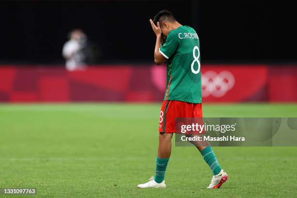 Carlos Rodriguez of Team Mexico looks dejected as he leaves the pitch after being shown a red card during the Men's First Round Group A match between...