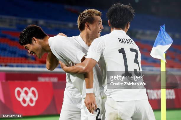 Sakai Hiroki of Japan celebrates his scoring with teammates during the Men's Group A match between France and Japan on day five of the Tokyo 2020...