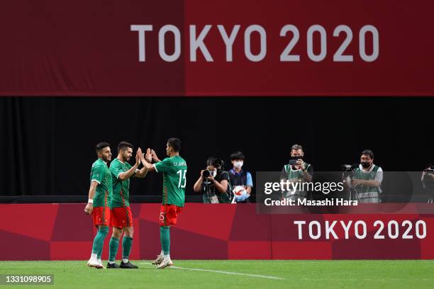 Alexis Vega of Team Mexico celebrates with Uriel Antuna after scoring their side's third goal during the Men's First Round Group A match between...