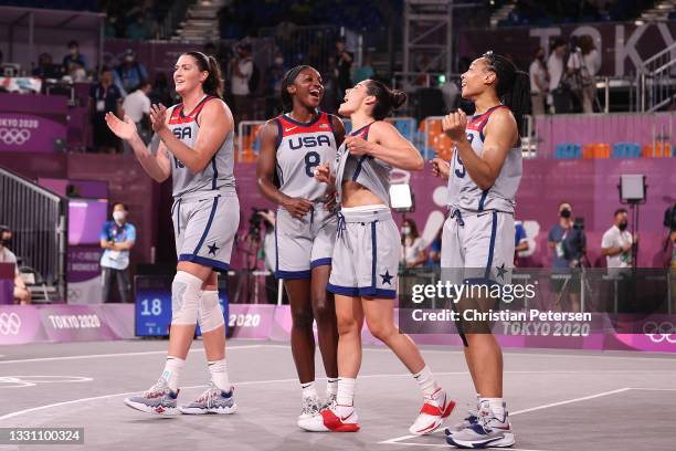 Stefanie Dolson, Jacquelyn Young, Kelsey Plum and Allisha Gray of Team United States celebrate victory and winning the gold medal in the 3x3...
