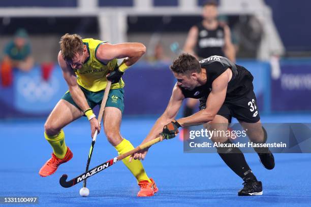 Joshua Simmonds of Team Australia and Nick Wilson of Team New Zealand battle for the ball during the Men's Preliminary Pool A match between Australia...