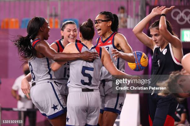 Jacquelyn Young, Stefanie Dolson, Kelsey Plum, and Allisha Gray of Team United States celebrate victory and winning the gold medal in the 3x3...