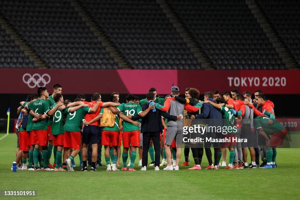 Players of Team Mexico form a huddle after the Men's First Round Group A match between South Africa and Mexico on day five of the Tokyo 2020 Olympic...