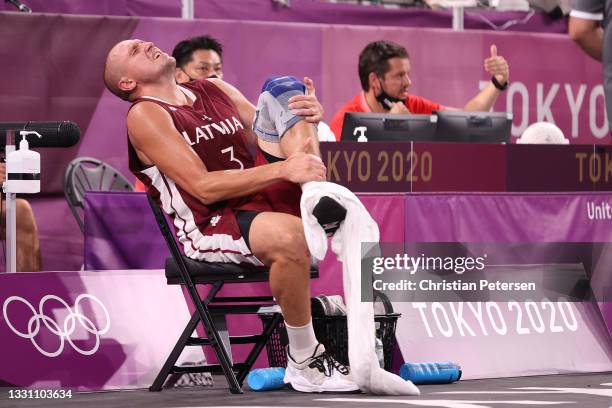 Edgars Krumins of Team Latvia is seen after a collision in the 3x3 Basketball competition on day five of the Tokyo 2020 Olympic Games at Aomi Urban...