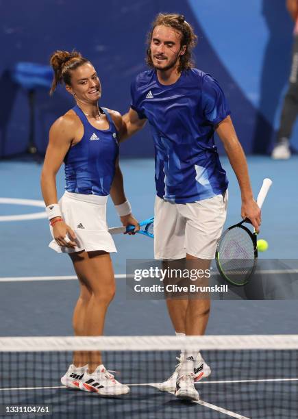 Stefanos Tsitsipas of Team Greece and Maria Sakkari of Team Greece celebrate match point against Felix Auger-Aliassime of Team Canada and Gabriela...