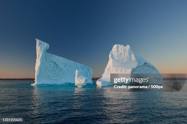 scenic view of sea against clear sky during winter - iceberg stock pictures, royalty-free photos & images