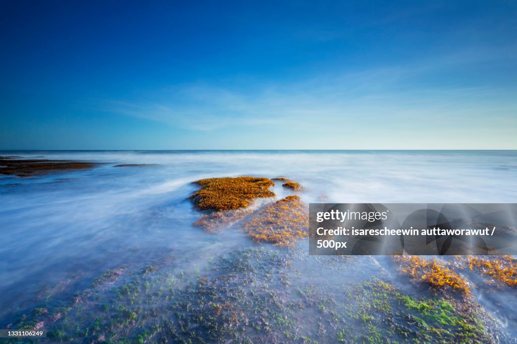 Scenic view of sea against blue sky,Bali,Indonesia