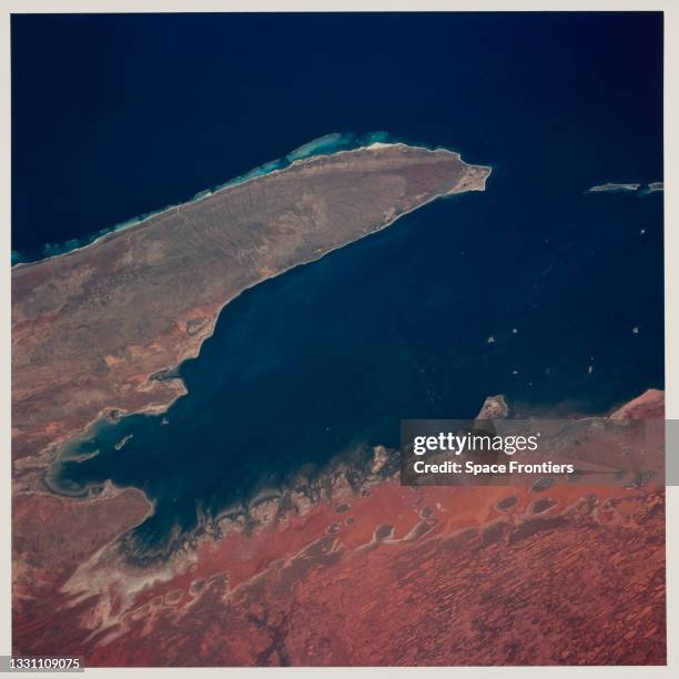 The Exmouth Gulf, Western Australia, is bounded on the west by the Cape Ranges, near the base of the peninsula the Learmonth Airfield, site of a...