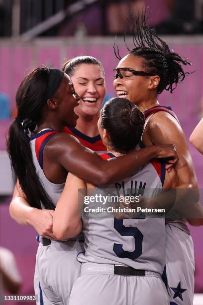 Jacquelyn Young, Stefanie Dolson, Kelsey Plum, and Allisha Gray of Team United States celebrate victory and winning the gold medal in the 3x3...