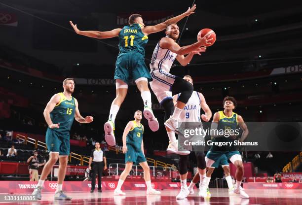 Stefano Tonut of Team Italy drives to the basket against Dante Exum of Team Australia during the first half of a Men's Preliminary Round Group B game...