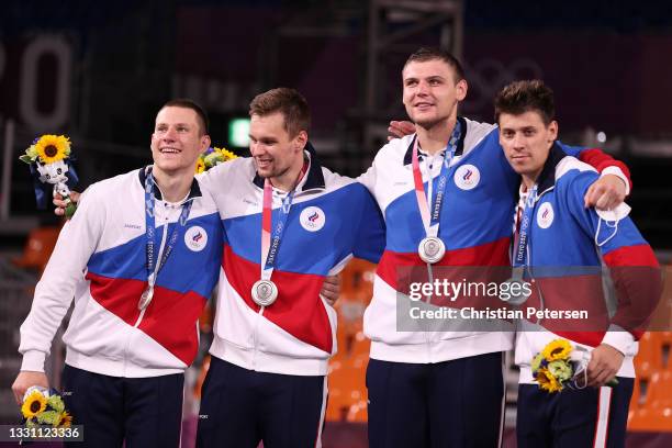 Silver medalists Stanislav Sharov, Alexander Zuev, Ilia Karpenkov and Kirill Pisklov of Team ROC pose with the silver medal for the 3x3 Basketball...