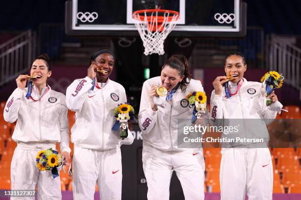 Gold medalists Kelsey Plum, Jacquelyn Young, Stefanie Dolson and Allisha Gray of Team United States pose on the podium during the medal ceremony for...